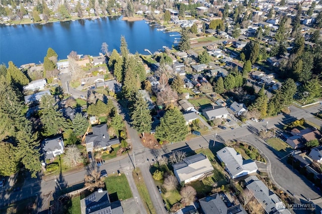 birds eye view of property featuring a residential view and a water view