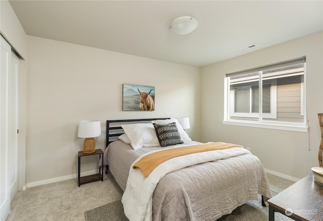 bedroom with light carpet