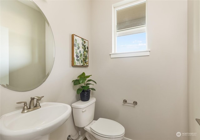 bathroom with sink and toilet