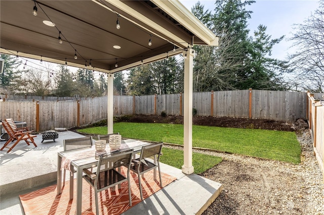 view of patio with a fire pit