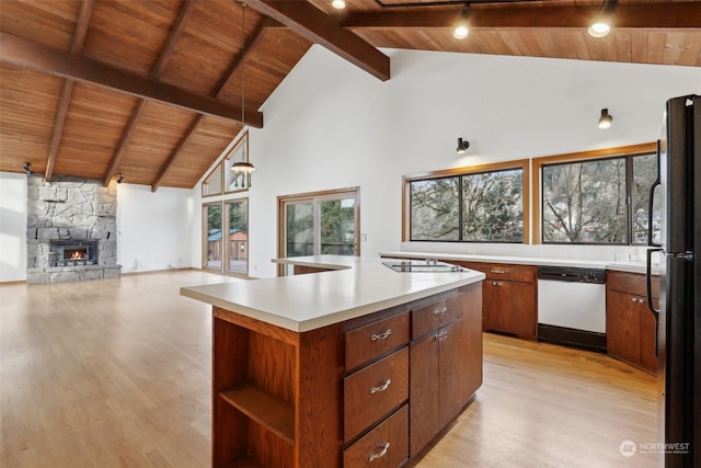 kitchen featuring black refrigerator, high vaulted ceiling, dishwasher, a center island, and wooden ceiling