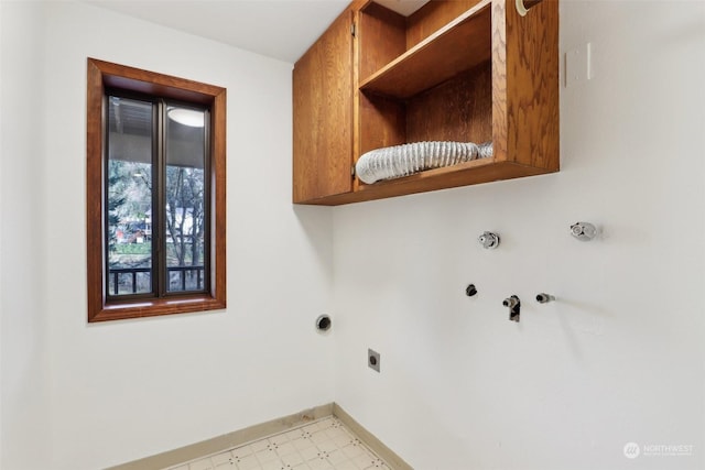 laundry room featuring hookup for a gas dryer, electric dryer hookup, and cabinets