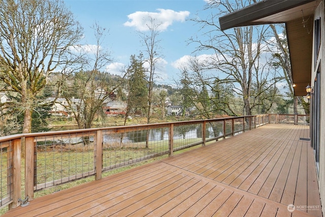 wooden deck featuring a water view