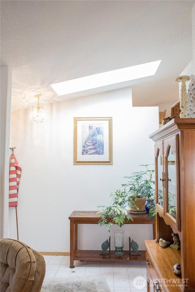 hall featuring a skylight