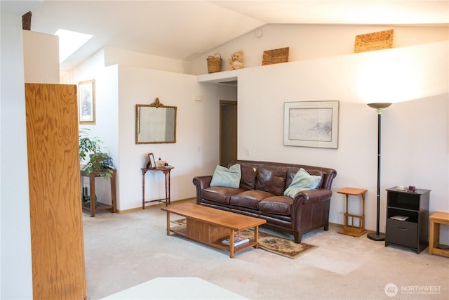 living area featuring lofted ceiling and carpet floors