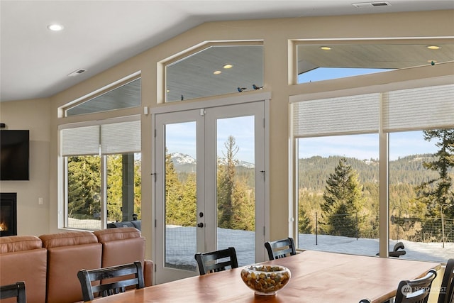 doorway featuring lofted ceiling and french doors