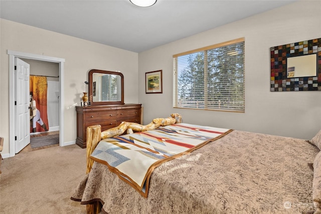 bedroom featuring light carpet