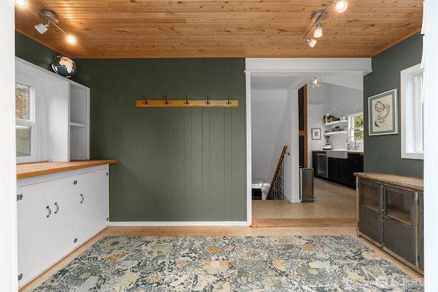 kitchen featuring open shelves, a sink, white cabinets, wood counters, and wooden ceiling