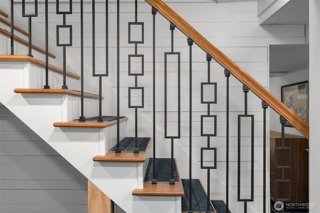 stairs with tile walls