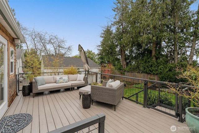 deck with outdoor lounge area and fence