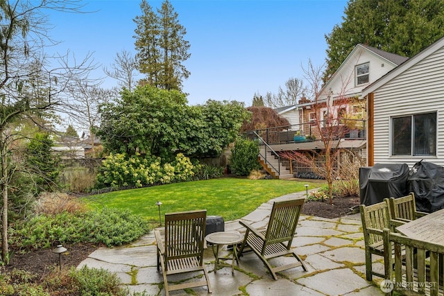 view of patio featuring stairway and area for grilling