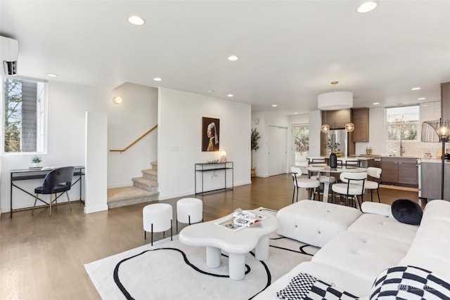 living room with sink and dark hardwood / wood-style floors