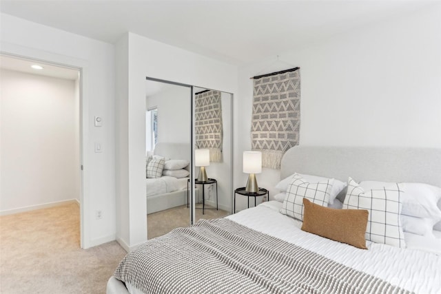 carpeted bedroom with a closet