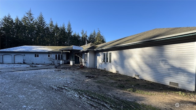 view of side of property featuring a garage