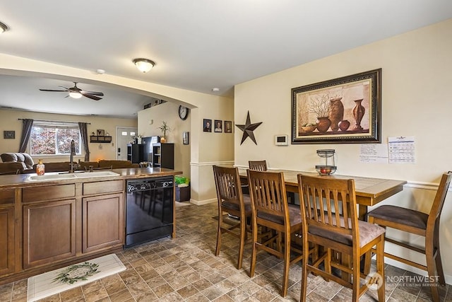 kitchen featuring ceiling fan, dishwasher, and sink