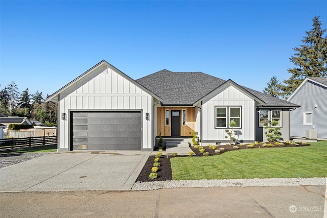 modern farmhouse with a garage, cooling unit, and a front yard