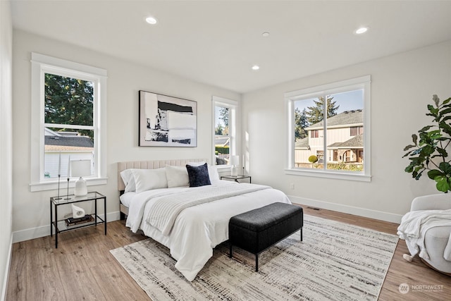 bedroom with light wood-type flooring