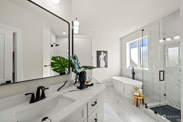 bathroom featuring vanity and separate shower and tub