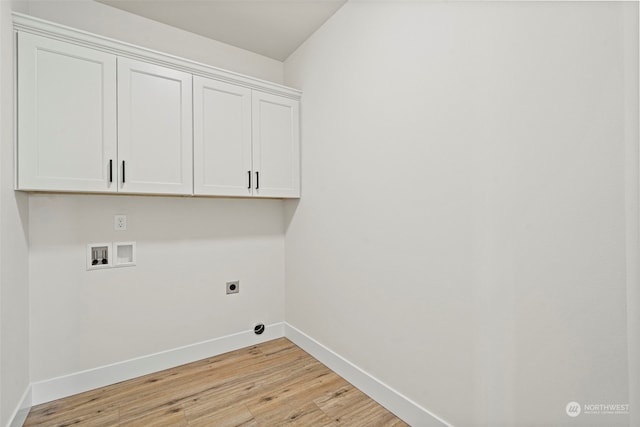 laundry area featuring hookup for an electric dryer, cabinets, light hardwood / wood-style flooring, and hookup for a washing machine