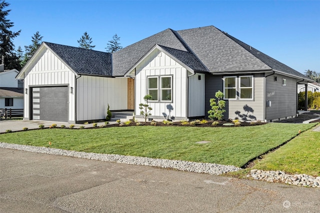 modern farmhouse featuring a garage and a front lawn