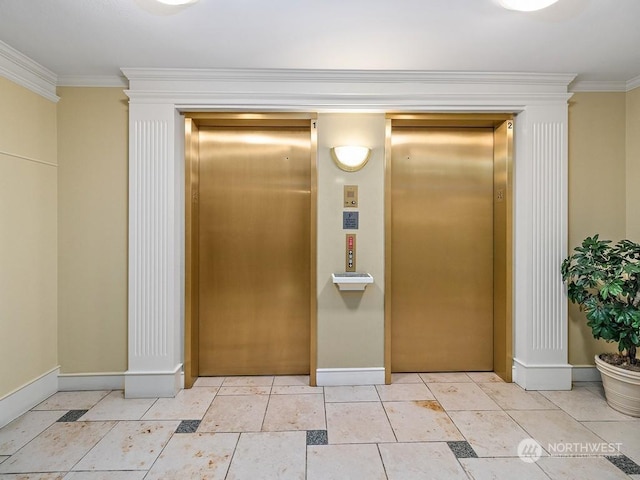 corridor featuring ornamental molding, elevator, and light tile patterned flooring