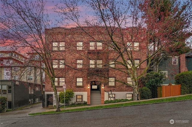 view of outdoor building at dusk