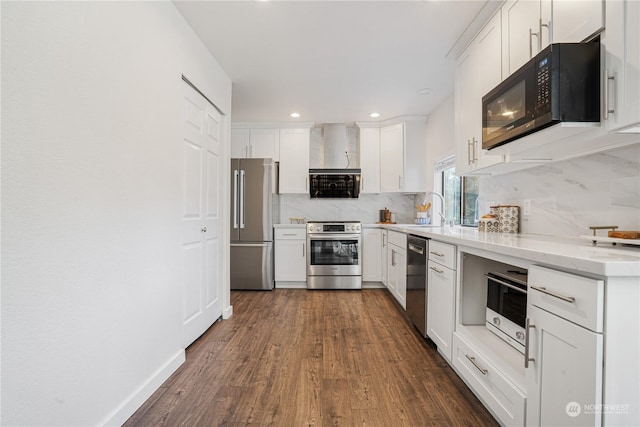 kitchen with sink, tasteful backsplash, white cabinetry, and stainless steel appliances