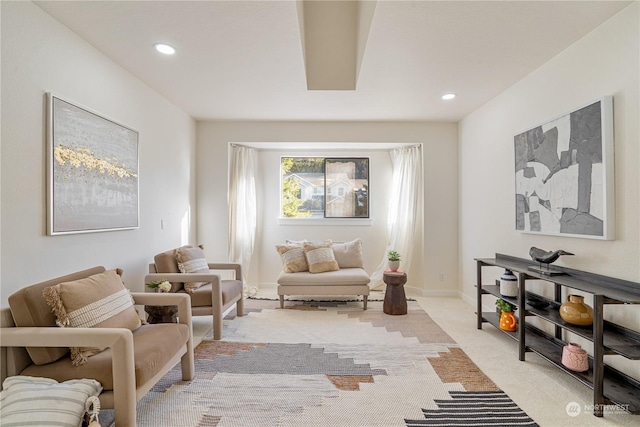 sitting room with light colored carpet