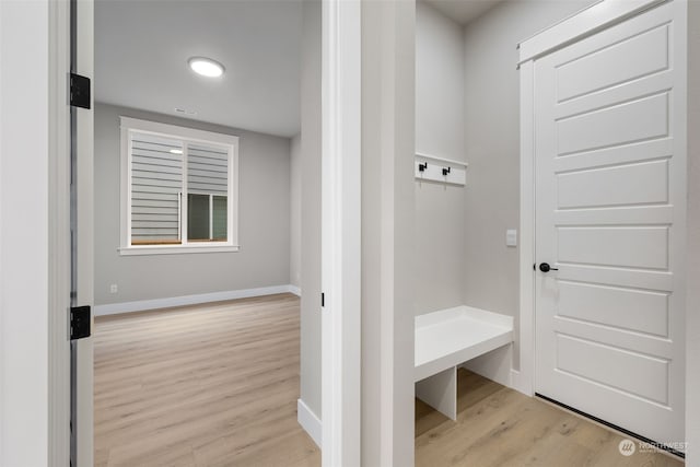 mudroom with light hardwood / wood-style flooring