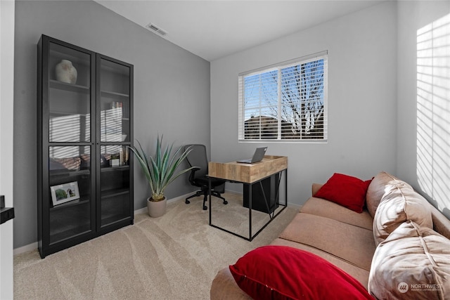 home office featuring light colored carpet