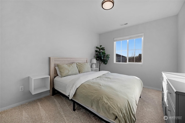 bedroom with light colored carpet