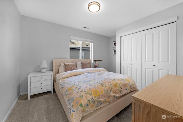 carpeted bedroom featuring a closet