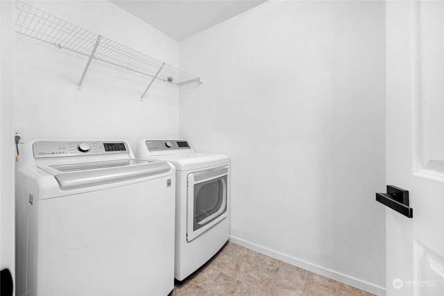 washroom featuring independent washer and dryer