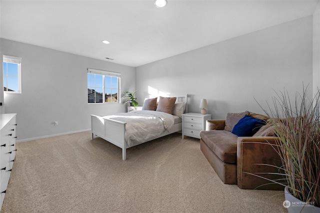 bedroom featuring light carpet