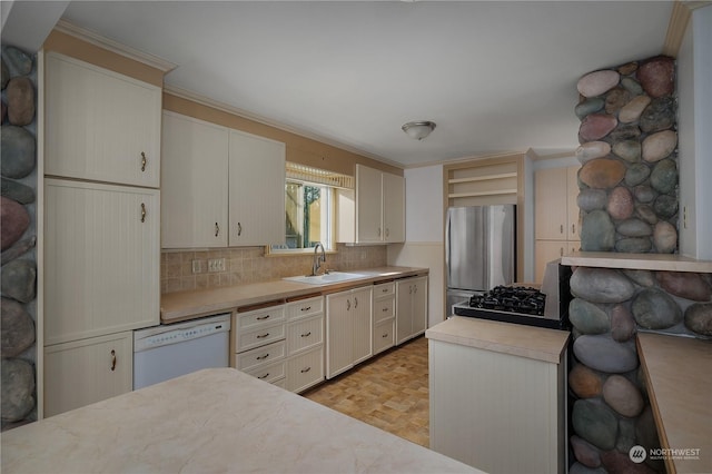 kitchen with white dishwasher, sink, backsplash, light parquet floors, and stainless steel refrigerator