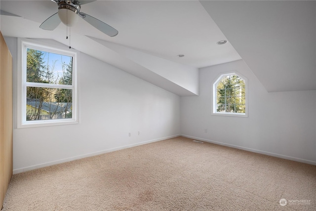 bonus room featuring ceiling fan, vaulted ceiling, and carpet flooring