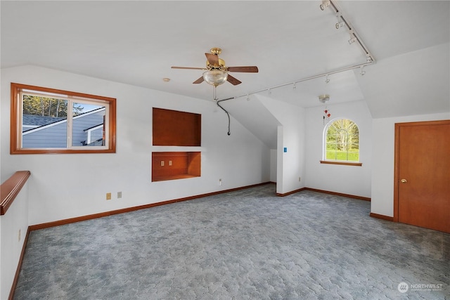 bonus room featuring ceiling fan, carpet flooring, and lofted ceiling