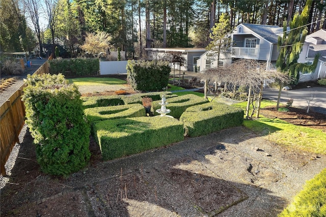 view of yard with a balcony