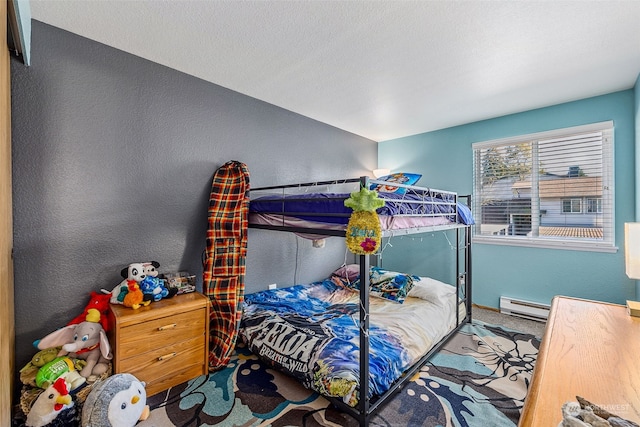 carpeted bedroom featuring a baseboard radiator