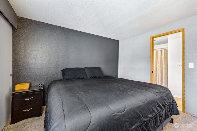 carpeted bedroom with a textured ceiling