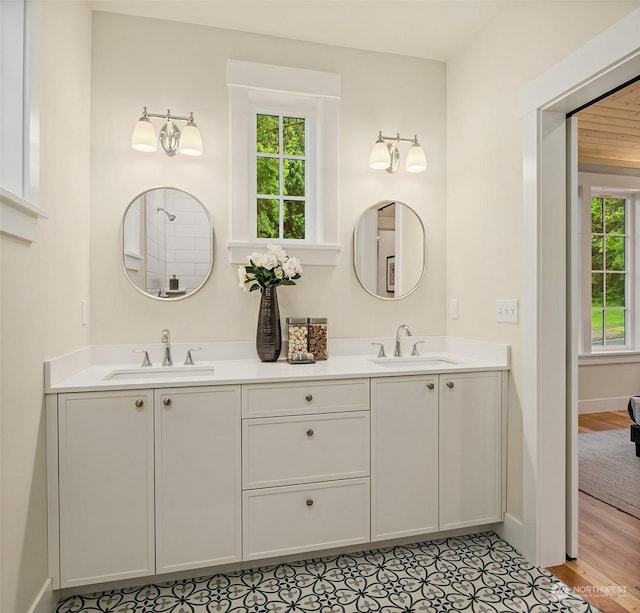 bathroom with tile patterned floors and vanity