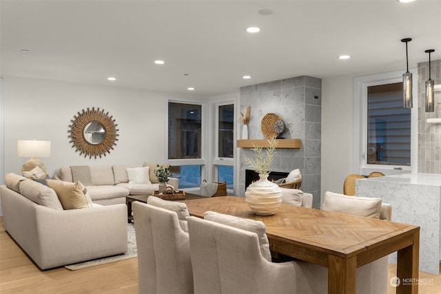 living room featuring light hardwood / wood-style flooring and a fireplace