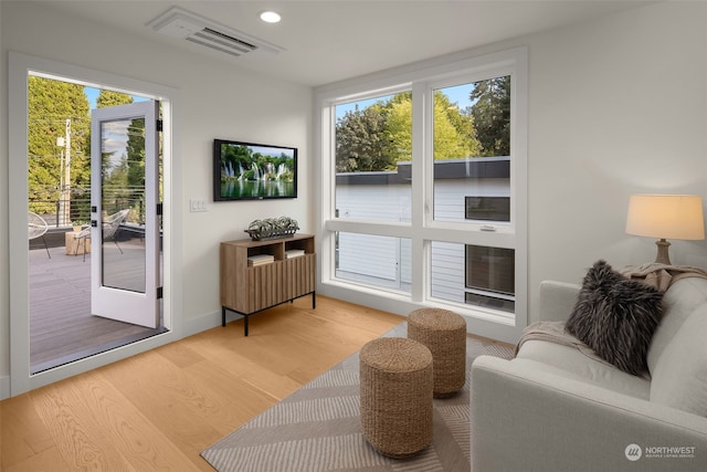 living area with hardwood / wood-style floors