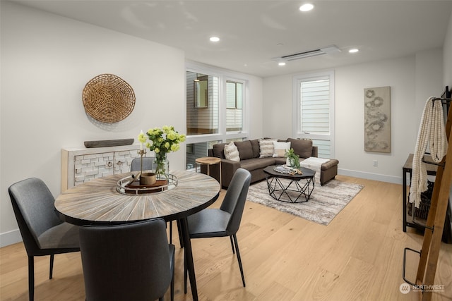 dining room with light hardwood / wood-style flooring