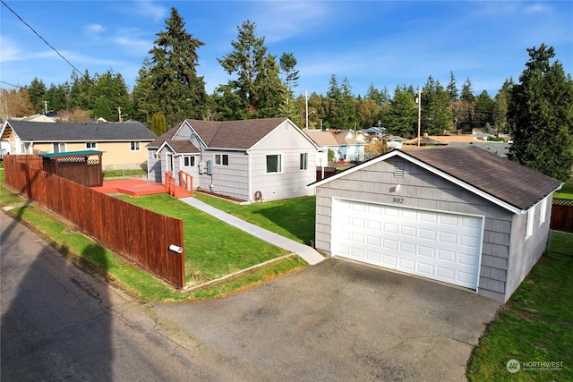 view of front of property with an outbuilding, a garage, and a front lawn