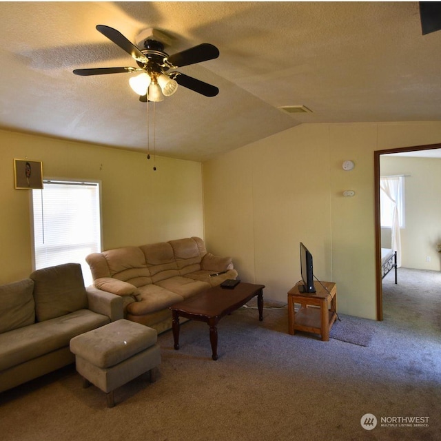 carpeted living room featuring lofted ceiling, a wealth of natural light, and ceiling fan