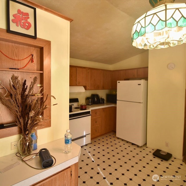 kitchen featuring white appliances, vaulted ceiling, and ventilation hood