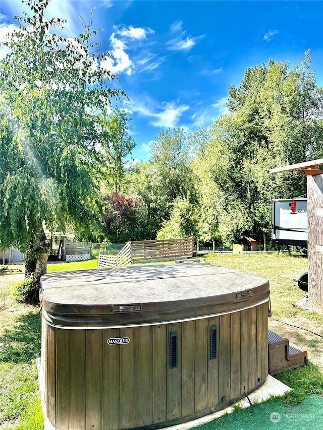 exterior space with a hot tub