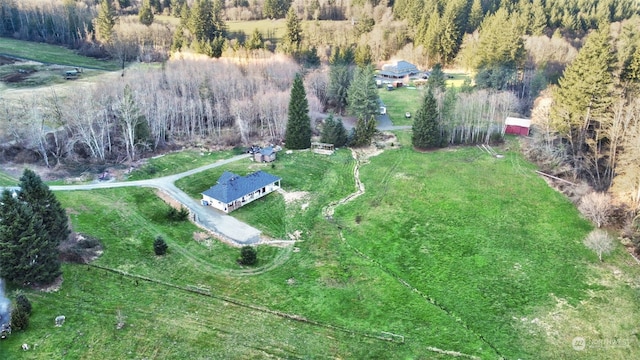 birds eye view of property with a rural view