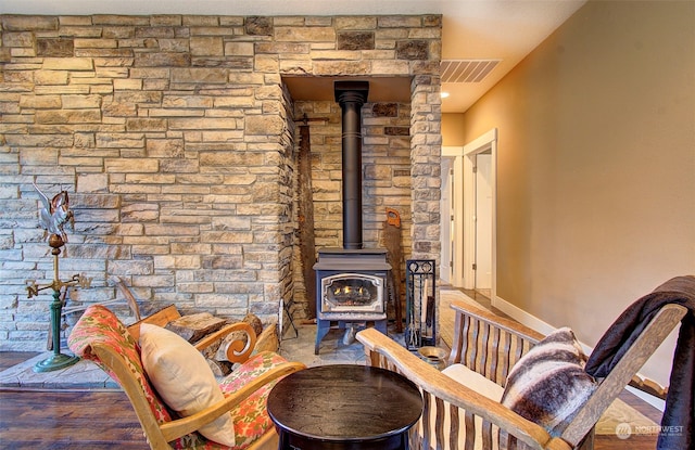 living room featuring a wood stove